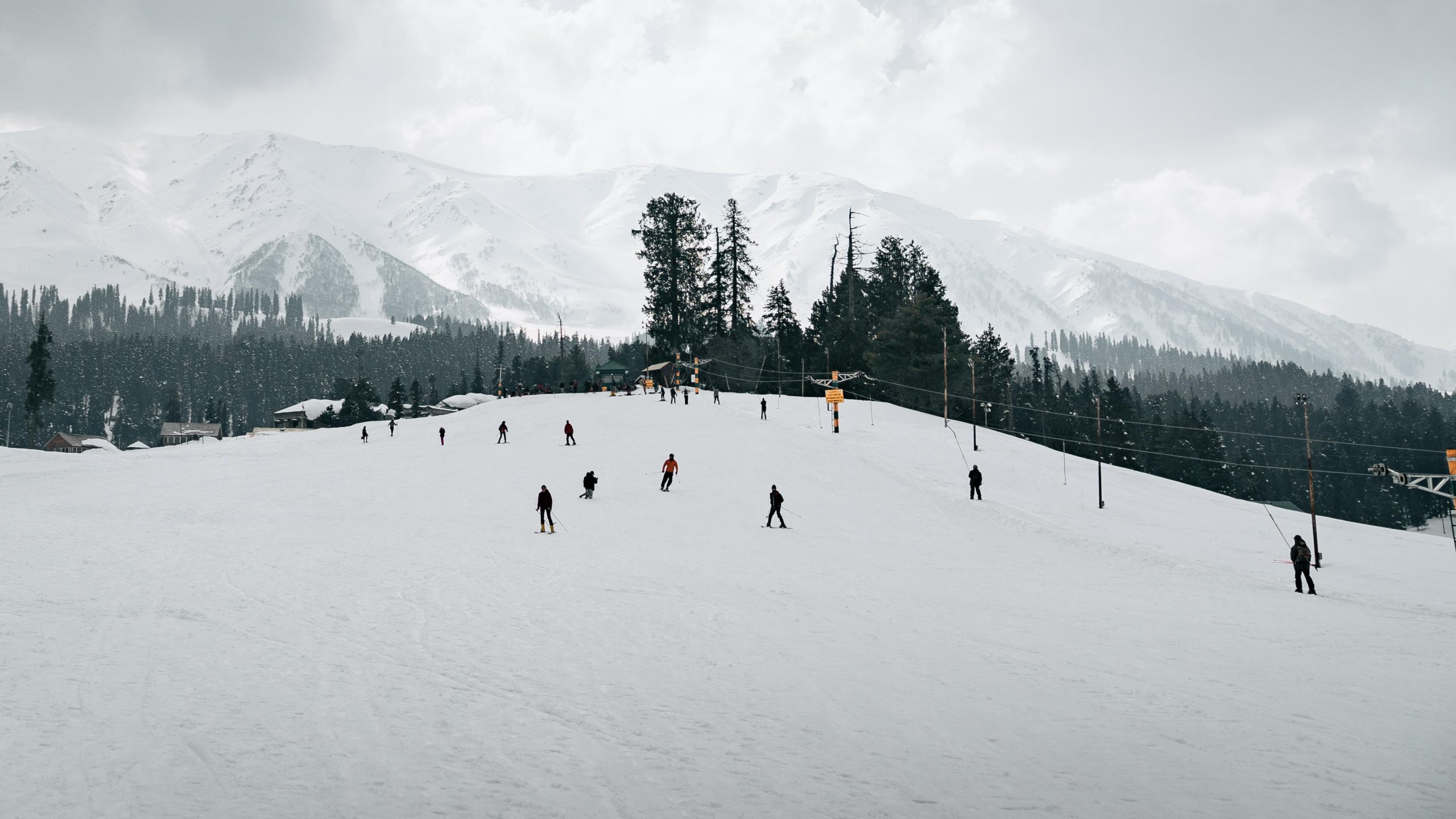 Tourists are busily Skiing 