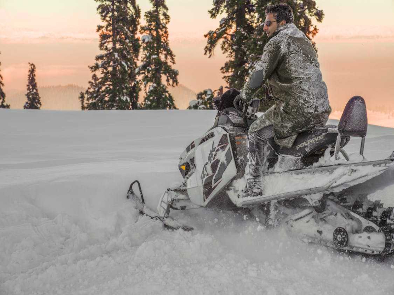 Tourists having a snowmobile ride