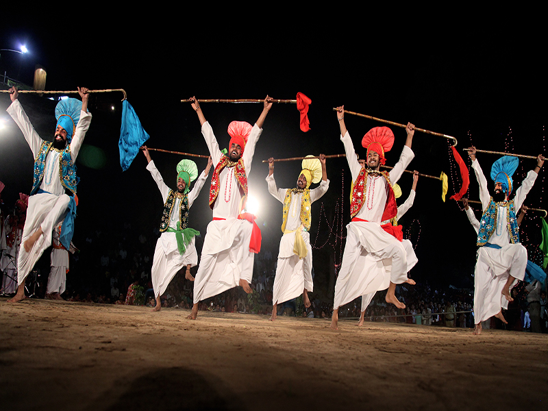 Locals perform on a stage