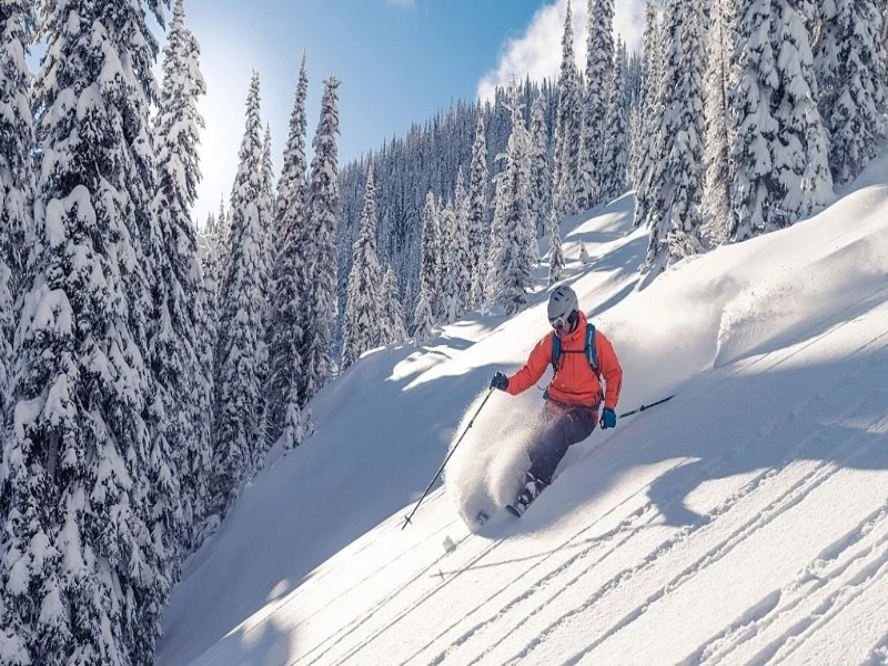 A skier is jumping from a slope in Gulmarg.